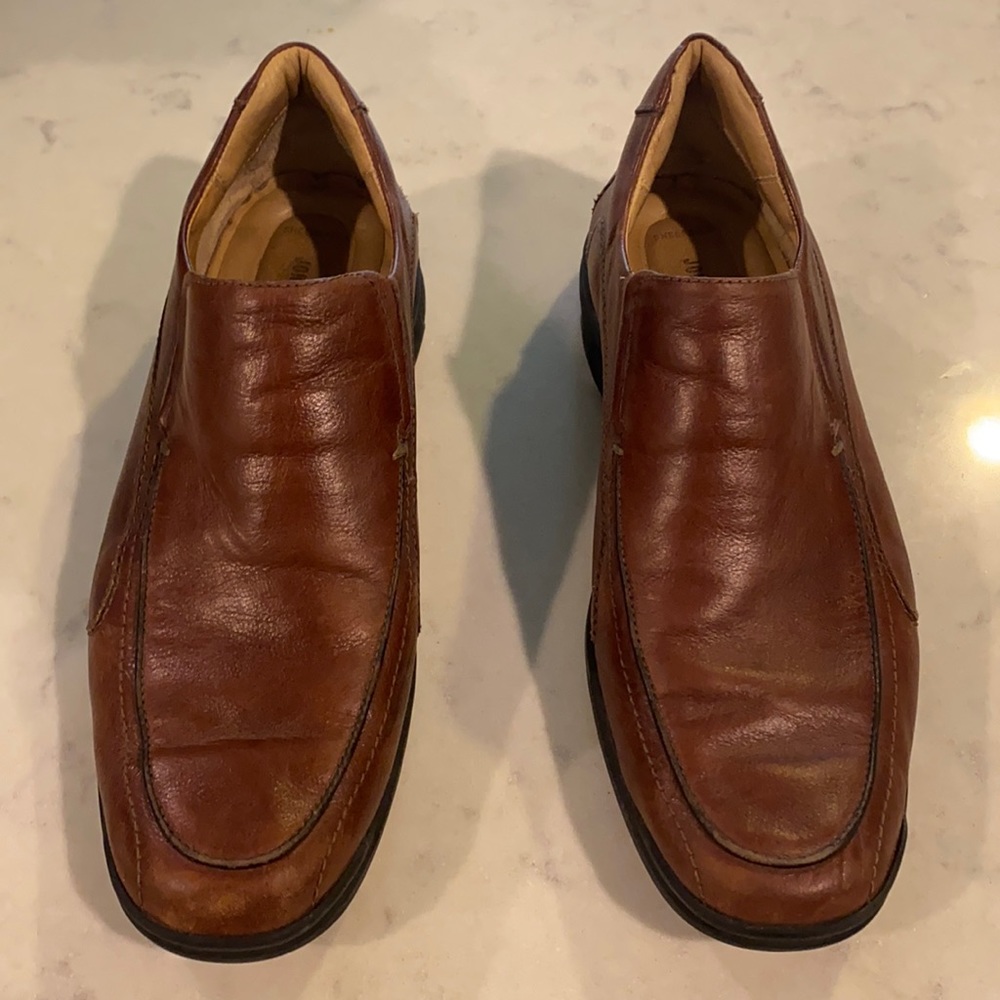 Johnston and Murphy brown leather slip ons.